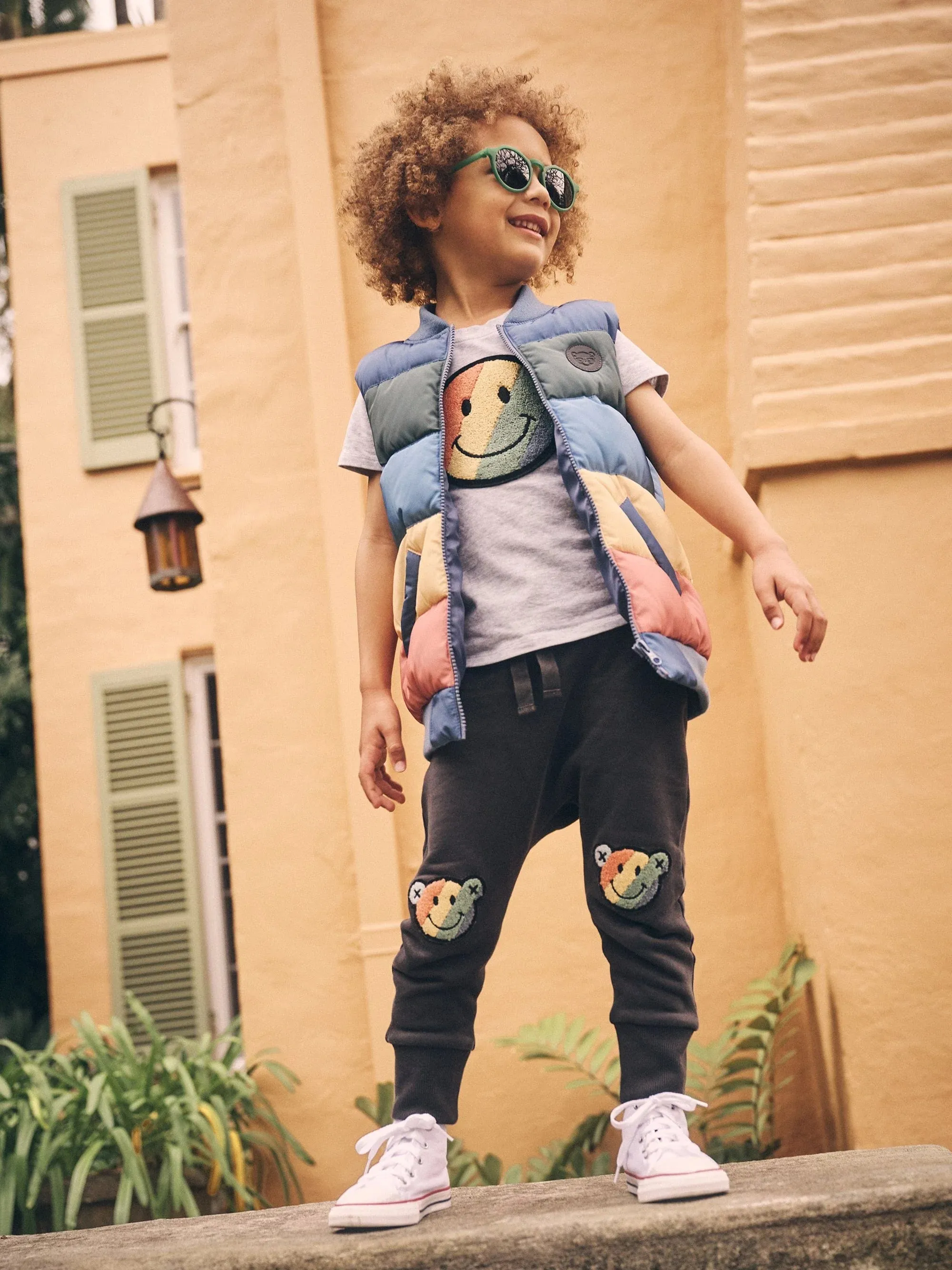 Smiley rainbow puffer boy vest